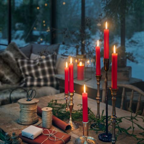 Liljeholmens Stearinfabrik's red Christmas candles create ambiance